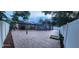 Expansive backyard with brick-style tiling, privacy fence and screened-in pool area at 112 Rosewood Ct, Kissimmee, FL 34743