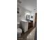 This bathroom features a stylish glass vessel sink, modern fixtures, and lots of natural light at 112 Rosewood Ct, Kissimmee, FL 34743