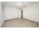 Simple bedroom with tile floors, white walls, and natural light from a window at 112 Rosewood Ct, Kissimmee, FL 34743