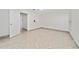 Bright empty bedroom with a ceiling fan, closet, and tile flooring at 112 Rosewood Ct, Kissimmee, FL 34743