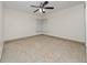 Bright bedroom features tile flooring, ceiling fan and natural light at 112 Rosewood Ct, Kissimmee, FL 34743