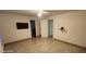 Neutral bedroom with an attached bath and tile floors, offers a spacious and airy feel at 112 Rosewood Ct, Kissimmee, FL 34743