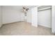 Bright, empty bedroom with a ceiling fan, closet, and tile flooring at 112 Rosewood Ct, Kissimmee, FL 34743