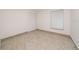 This cozy bedroom features tile floors, a window, and a closet at 112 Rosewood Ct, Kissimmee, FL 34743