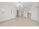Spacious dining area with decorative chandelier and tile floors at 112 Rosewood Ct, Kissimmee, FL 34743