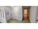 Hallway with closet space and access to other rooms in the home at 112 Rosewood Ct, Kissimmee, FL 34743