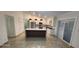 Open kitchen with island, modern appliances, and sleek countertops at 112 Rosewood Ct, Kissimmee, FL 34743