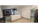 Open concept kitchen with large island, modern appliances, and ample cabinet space at 112 Rosewood Ct, Kissimmee, FL 34743