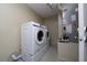 Functional laundry room with front-load washer and dryer, plus an efficient HVAC system at 112 Rosewood Ct, Kissimmee, FL 34743