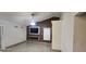 Living room featuring high ceilings, a fan, and modern fireplace at 112 Rosewood Ct, Kissimmee, FL 34743