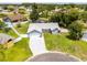 Beautiful home with manicured lawn, fenced yard, long driveway, and mature landscaping at 113 Candlewood Ct, Kissimmee, FL 34743