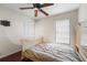 Neutral bedroom featuring a closet, and a ceiling fan for added comfort at 113 Candlewood Ct, Kissimmee, FL 34743