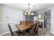 Elegant dining room adjacent to the kitchen, perfect for Gathering meals and entertaining guests at 113 Candlewood Ct, Kissimmee, FL 34743