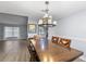 Inviting dining room featuring a chandelier and stylish wood table, creating an ideal space for gatherings at 113 Candlewood Ct, Kissimmee, FL 34743