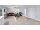 Bright living room with wood floors, vaulted ceiling and comfortable seating arrangement at 113 Candlewood Ct, Kissimmee, FL 34743