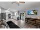 Open living area with kitchen access, showcasing stainless steel appliances and a seamless flow to the pool area at 113 Candlewood Ct, Kissimmee, FL 34743