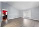 Spacious living room featuring vaulted ceilings, light paint and neutral flooring for a bright, airy atmosphere at 113 Candlewood Ct, Kissimmee, FL 34743