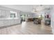 Spacious living room with light floors, vaulted ceilings and access to the patio at 113 Candlewood Ct, Kissimmee, FL 34743