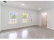 Bright and airy living room offers tile floors, natural light, and access to other rooms at 13 Oak Trail Pl, Ocala, FL 34472