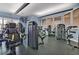 Well-equipped gym featuring modern exercise machines and ample natural light at 1357 Venezia Ct # 302, Davenport, FL 33896