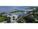 Aerial view of marina and lakeside property with boats docked near lush green trees at 1422 Indiana Ave, St Cloud, FL 34769