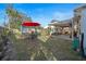 Spacious backyard featuring outdoor seating and a well-maintained lawn at 1422 Indiana Ave, St Cloud, FL 34769