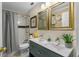 Bright bathroom featuring a double sink vanity, shower with stylish tile, and modern fixtures at 1422 Indiana Ave, St Cloud, FL 34769