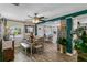 Inviting dining room with a dining table and bench, bright windows, and stylish decor at 1422 Indiana Ave, St Cloud, FL 34769