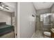 View from bedroom to bathroom with a tiled shower at 1607 Wilson Ave, Orlando, FL 32804