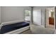 Bright bedroom with a pull out bed, closet and access to a bathroom at 1607 Wilson Ave, Orlando, FL 32804