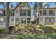 Inviting townhome with a cozy front porch and lush landscaping at 1607 Wilson Ave, Orlando, FL 32804