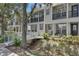 Charming townhome with a white bridge walkway and cozy front porch at 1607 Wilson Ave, Orlando, FL 32804