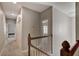 Upstairs hallway with carpet, closet, and railing at 1607 Wilson Ave, Orlando, FL 32804