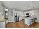 Modern kitchen with stainless steel appliances and breakfast bar at 1607 Wilson Ave, Orlando, FL 32804