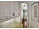 Kitchen with granite countertops and modern appliances, offers easy access to entryway at 1607 Wilson Ave, Orlando, FL 32804