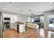 Bright open-concept, combining the living room and kitchen, hardwood floors at 1607 Wilson Ave, Orlando, FL 32804