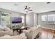 Comfortable living room with hardwood floors, a ceiling fan, and lots of natural light at 1607 Wilson Ave, Orlando, FL 32804