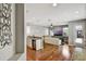 Open-concept living room featuring a stylish granite counter and wood floors at 1607 Wilson Ave, Orlando, FL 32804