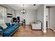 Open-concept living space features hardwood floors and an accent wall at 1607 Wilson Ave, Orlando, FL 32804
