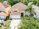 Spacious home in a desirable neighborhood with mature trees and a well-kept lawn at 195 Hideaway Beach Ln, Kissimmee, FL 34746