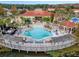 A high angle aerial shot of the resort pool, pool deck, and building at 195 Hideaway Beach Ln, Kissimmee, FL 34746