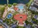 Aerial view of the resort pool, basketball court, and common areas, surrounded by lush landscaping at 195 Hideaway Beach Ln, Kissimmee, FL 34746
