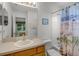 Bright bathroom with a shower/tub combo and a vanity with a white sink at 195 Hideaway Beach Ln, Kissimmee, FL 34746