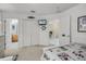 Bright bedroom showcasing neutral tones, an ensuite bathroom, and ample closet space, providing comfort and convenience at 195 Hideaway Beach Ln, Kissimmee, FL 34746