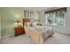 Comfortable bedroom featuring a queen-sized bed, carpet and a pair of end tables at 195 Hideaway Beach Ln, Kissimmee, FL 34746