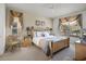 Comfortable bedroom with a bed, stylish curtains, bedside tables, and view to an outdoor patio at 195 Hideaway Beach Ln, Kissimmee, FL 34746