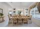 Bright dining room featuring a chandelier, neutral colors, and built-in shelving for displaying decorations at 195 Hideaway Beach Ln, Kissimmee, FL 34746
