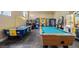 Inviting game room featuring a pool table, air hockey, arcade games, and vending machines at 195 Hideaway Beach Ln, Kissimmee, FL 34746
