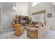 Spacious living room with high ceilings, tile floors, comfortable seating, and large windows for natural light at 195 Hideaway Beach Ln, Kissimmee, FL 34746