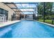 Gorgeous screened-in pool with crystal-clear water and comfortable seating, perfect for relaxation and leisure at 195 Hideaway Beach Ln, Kissimmee, FL 34746